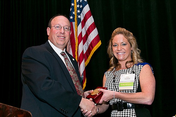 Kelly Edington receives a Distinguished Young AFCEAN Award from Cusano in December.